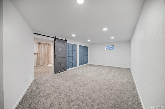 2020 Forest Ridge Dr, Colorado Springs, CO 80918 - carpeted empty room featuring recessed lighting, baseboards, visible vents, and a barn door