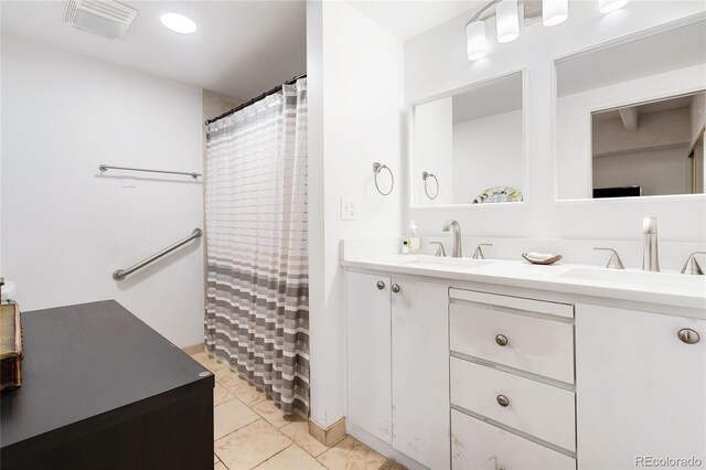 bathroom with vanity and a shower with shower curtain