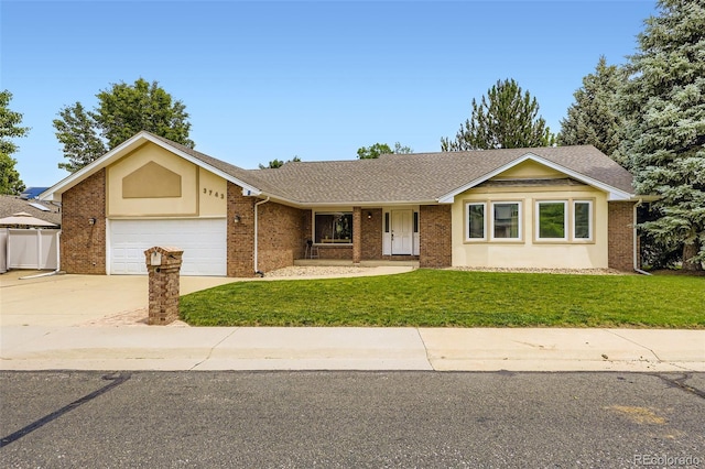 3743 W 103rd Dr, Westminster, CO 80031 - ranch-style house featuring a front lawn, an attached garage, concrete driveway, brick siding, and a shingled roof