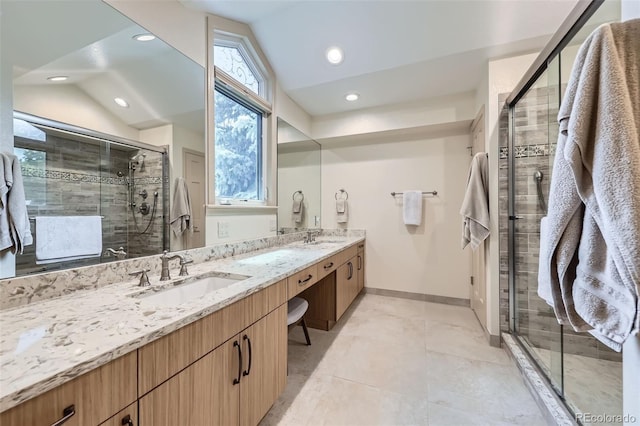 3743 W 103rd Dr, Westminster, CO 80031 - full bathroom with double vanity, vaulted ceiling, a stall shower, recessed lighting, and tile patterned flooring