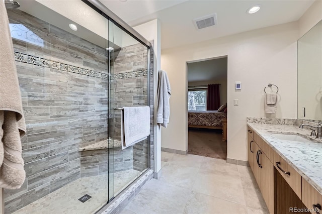 3743 W 103rd Dr, Westminster, CO 80031 - full bathroom featuring connected bathroom, a shower stall, vanity, tile patterned floors, and recessed lighting