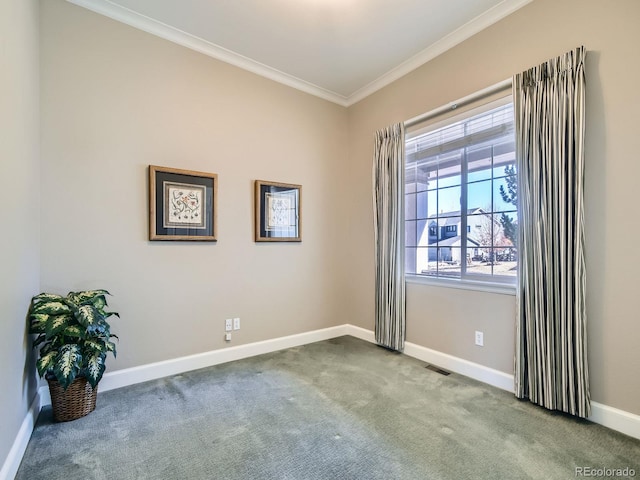 carpeted empty room with ornamental molding, visible vents, and baseboards