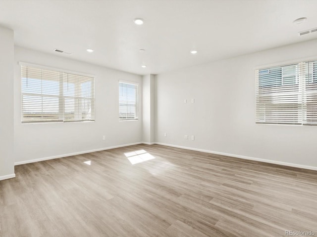 755 N Tibet St, Aurora, CO 80018 - unfurnished room with light wood-style flooring, baseboards, and recessed lighting