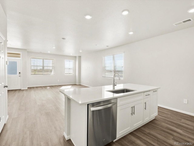 755 N Tibet St, Aurora, CO 80018 - kitchen featuring dishwasher, a sink, wood finished floors, open floor plan, and a center island with sink