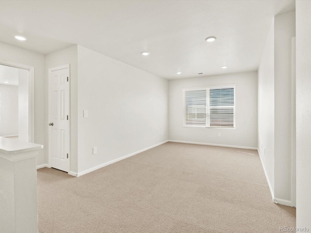 755 N Tibet St, Aurora, CO 80018 - empty room featuring light carpet, baseboards, and recessed lighting