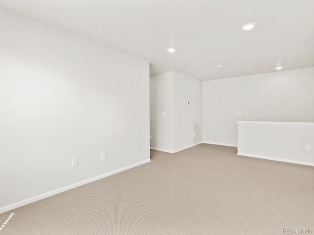 755 N Tibet St, Aurora, CO 80018 - unfurnished room featuring light carpet, baseboards, and recessed lighting