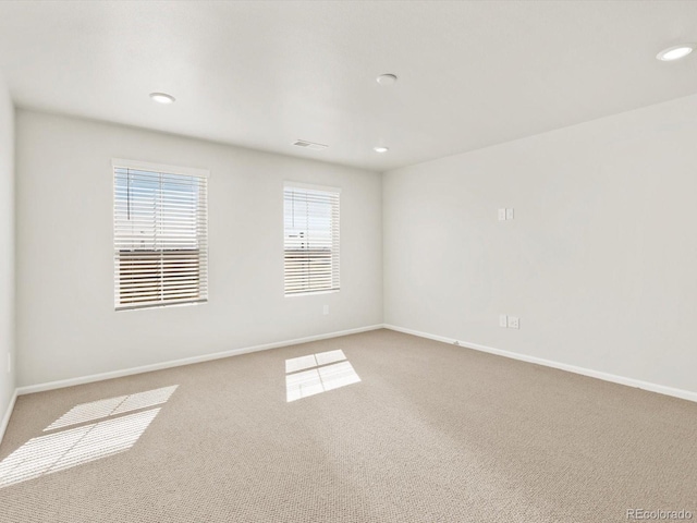 755 N Tibet St, Aurora, CO 80018 - carpeted spare room with baseboards and recessed lighting