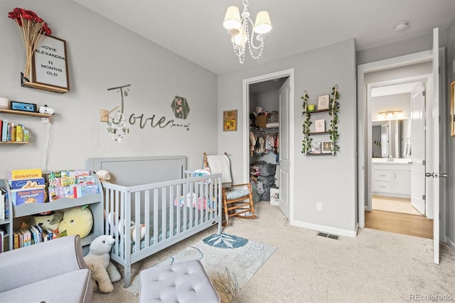 7268 Greenwater Cir, Castle Rock, CO 80108 - bedroom with carpet, a notable chandelier, visible vents, a nursery area, and baseboards