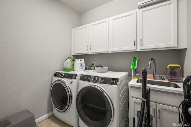 7268 Greenwater Cir, Castle Rock, CO 80108 - clothes washing area featuring cabinet space, washing machine and dryer, baseboards, and a sink