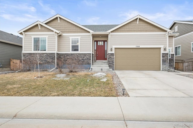 7268 Greenwater Cir, Castle Rock, CO 80108 - craftsman house featuring driveway, stone siding, and an attached garage