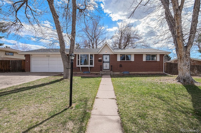 view of front of home with a garage and a front lawn