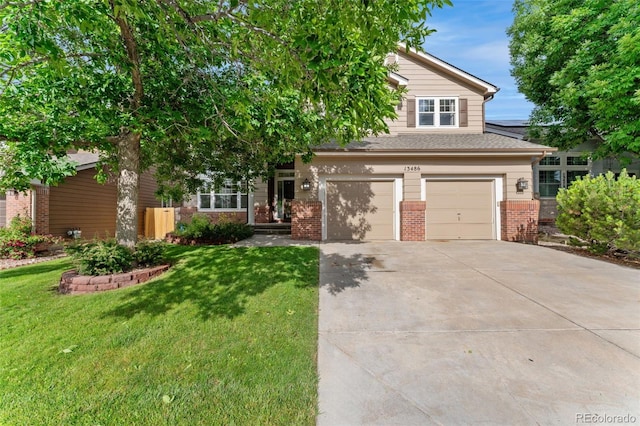 13486 Clayton St, Thornton, CO 80241 - view of front of property with brick siding, concrete driveway, a front lawn, and a garage