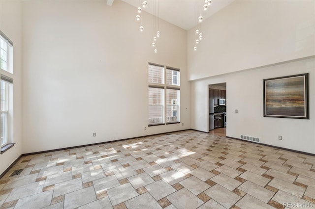 13486 Clayton St, Thornton, CO 80241 - spare room featuring a towering ceiling