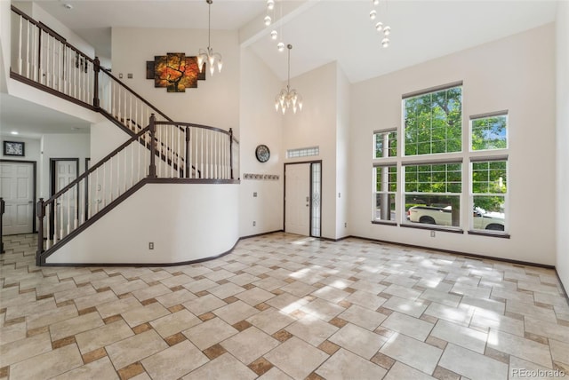 13486 Clayton St, Thornton, CO 80241 - unfurnished living room featuring high vaulted ceiling, a chandelier, and stairs