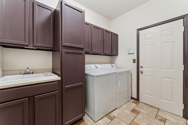 13486 Clayton St, Thornton, CO 80241 - laundry room with washer and clothes dryer, cabinet space, and light stone finish floors