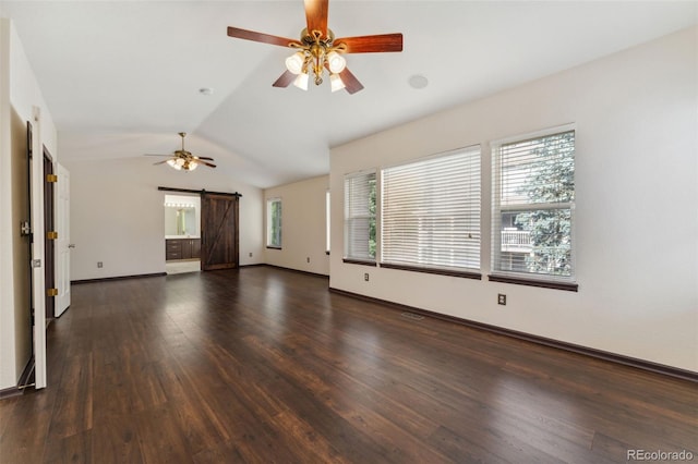 13486 Clayton St, Thornton, CO 80241 - unfurnished living room with a barn door, ceiling fan, wood finished floors, and vaulted ceiling