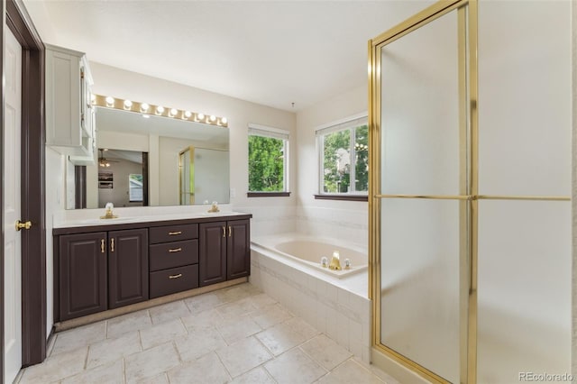 13486 Clayton St, Thornton, CO 80241 - full bath with double vanity, a bath, a stall shower, tile patterned floors, and ceiling fan