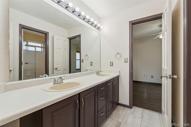 13486 Clayton St, Thornton, CO 80241 - full bathroom with double vanity, ceiling fan, and an enclosed shower