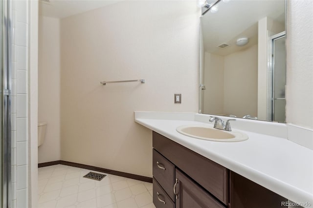 13486 Clayton St, Thornton, CO 80241 - bathroom featuring vanity, tile patterned floors, and a shower with door