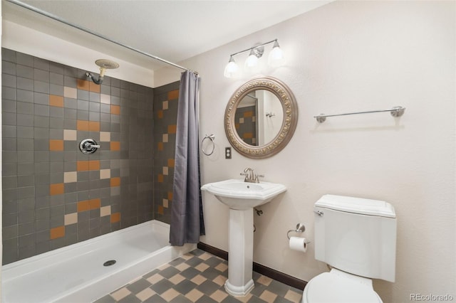 13486 Clayton St, Thornton, CO 80241 - bathroom featuring toilet and a tile shower