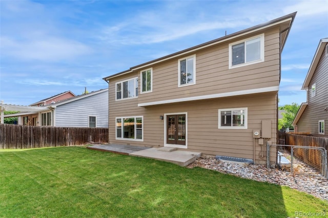 13486 Clayton St, Thornton, CO 80241 - back of house featuring a fenced backyard, french doors, and a patio