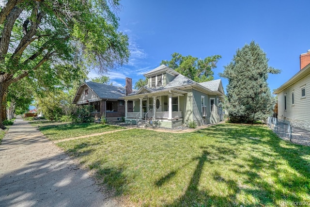 2226 N Greenwood St, Pueblo, CO 81003 - bungalow-style home with covered porch and a front yard