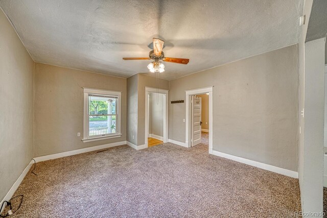 2226 N Greenwood St, Pueblo, CO 81003 - carpeted empty room featuring a ceiling fan, a textured ceiling, and baseboards