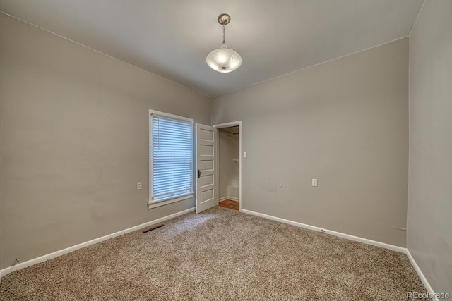 2226 N Greenwood St, Pueblo, CO 81003 - carpeted empty room with baseboards