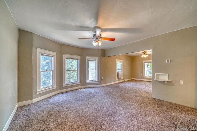 2226 N Greenwood St, Pueblo, CO 81003 - carpeted empty room with ceiling fan, baseboards, and a textured ceiling