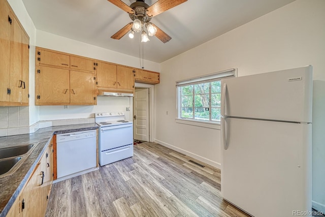 2226 N Greenwood St, Pueblo, CO 81003 - kitchen featuring white appliances, ceiling fan, under cabinet range hood, dark countertops, and light wood-style flooring