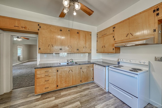 2226 N Greenwood St, Pueblo, CO 81003 - kitchen featuring white appliances, ceiling fan, under cabinet range hood, a sink, and dark countertops
