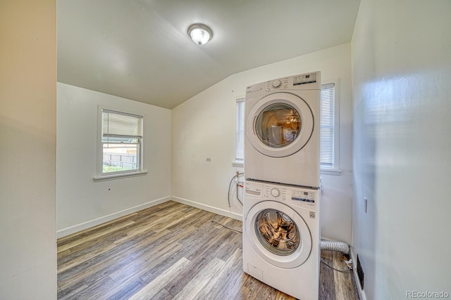2226 N Greenwood St, Pueblo, CO 81003 - laundry room with stacked washer / drying machine, wood finished floors, and baseboards