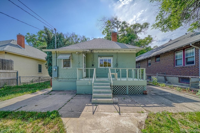 2226 N Greenwood St, Pueblo, CO 81003 - bungalow with a chimney, a wooden deck, and a shingled roof