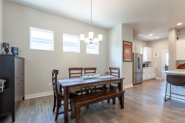 21574 E 59th Dr, Aurora, CO 80019 - dining space featuring a chandelier, wood finished floors, recessed lighting, and baseboards