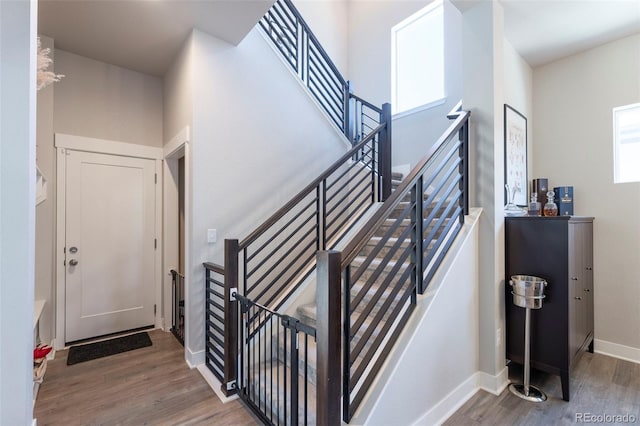 21574 E 59th Dr, Aurora, CO 80019 - staircase with wood finished floors and baseboards