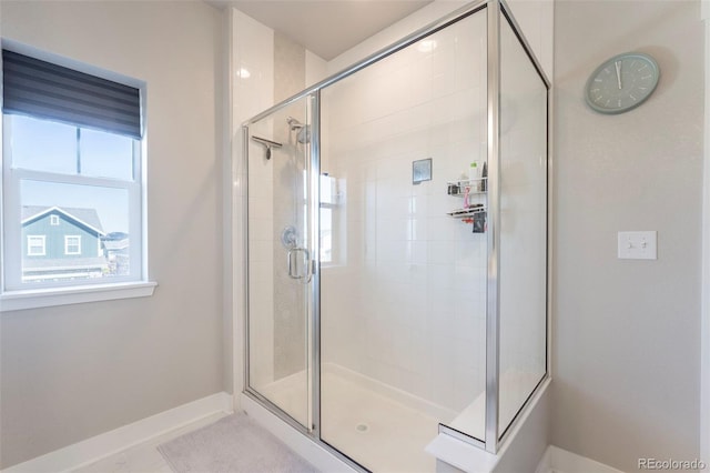 21574 E 59th Dr, Aurora, CO 80019 - full bathroom featuring a shower stall and baseboards