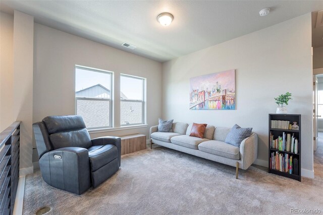 21574 E 59th Dr, Aurora, CO 80019 - carpeted living area featuring baseboards