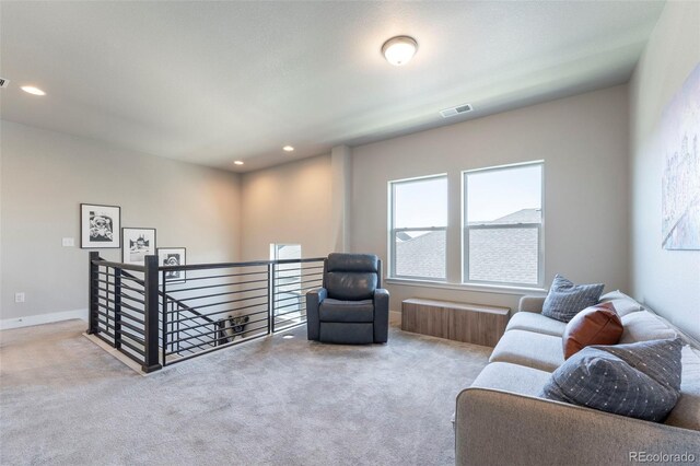 21574 E 59th Dr, Aurora, CO 80019 - living area featuring an upstairs landing, carpet, and recessed lighting
