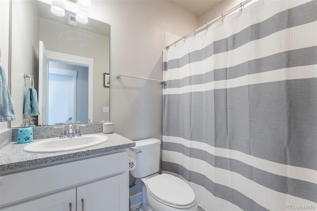 21574 E 59th Dr, Aurora, CO 80019 - bathroom featuring toilet, vanity, and a shower with shower curtain