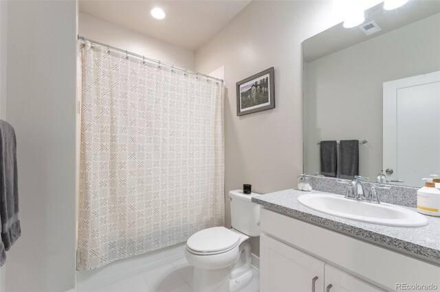 21574 E 59th Dr, Aurora, CO 80019 - bathroom featuring vanity, toilet, and tile patterned floors