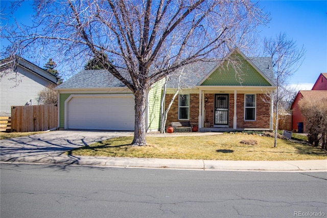 19930 E Cornell Ave, Aurora, CO 80013 - view of front of property with an attached garage, driveway, and brick siding