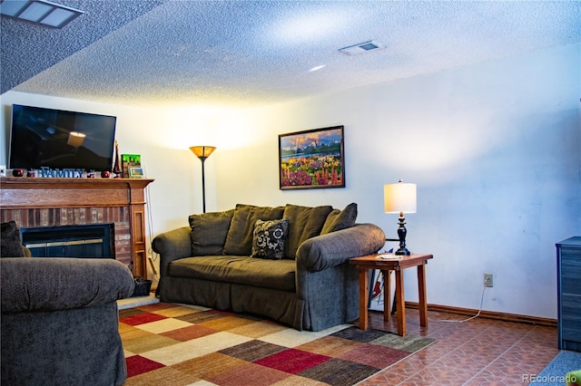 19930 E Cornell Ave, Aurora, CO 80013 - living area featuring a textured ceiling and a fireplace