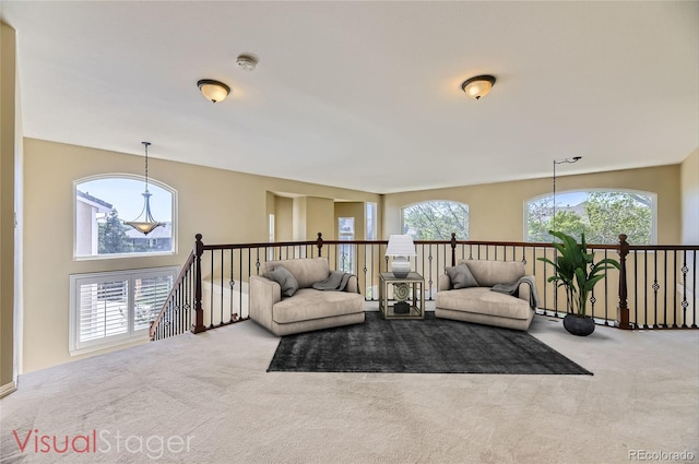2950 Wyecliff Ln, Highlands Ranch, CO 80126 - living area with carpet floors, plenty of natural light, and an upstairs landing