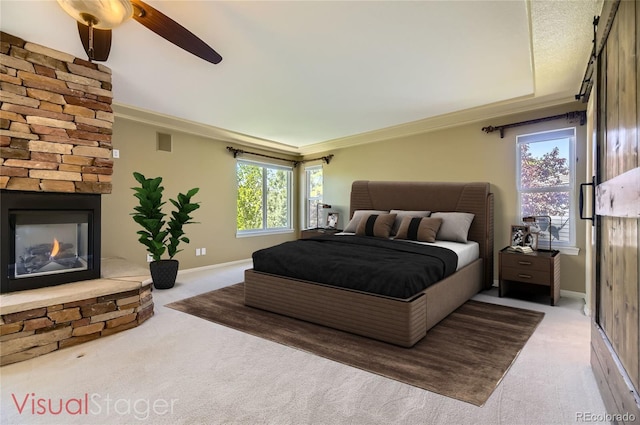 2950 Wyecliff Ln, Highlands Ranch, CO 80126 - bedroom featuring carpet floors, a stone fireplace, ornamental molding, baseboards, and a ceiling fan
