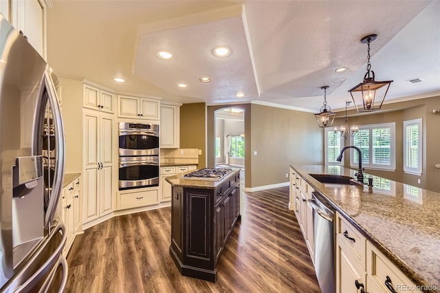 2950 Wyecliff Ln, Highlands Ranch, CO 80126 - kitchen with appliances with stainless steel finishes, a sink, dark wood-style flooring, light stone counters, and recessed lighting