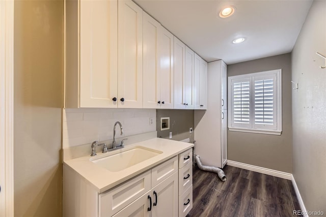 2950 Wyecliff Ln, Highlands Ranch, CO 80126 - washroom with cabinet space, baseboards, dark wood-style floors, hookup for a washing machine, and recessed lighting