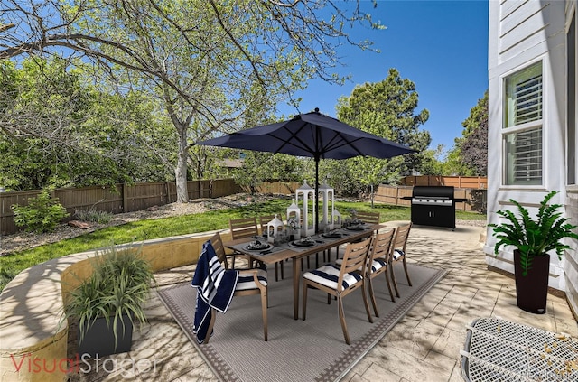2950 Wyecliff Ln, Highlands Ranch, CO 80126 - fenced backyard featuring area for grilling, outdoor dining area, and a patio area