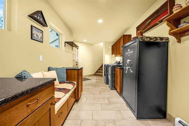 459 County Road 85, Guffey, CO 80820 - kitchen featuring separate washer and dryer, open shelves, brown cabinets, light tile patterned floors, and recessed lighting