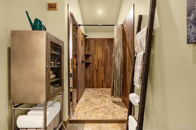 459 County Road 85, Guffey, CO 80820 - bathroom with a textured wall and a tile shower