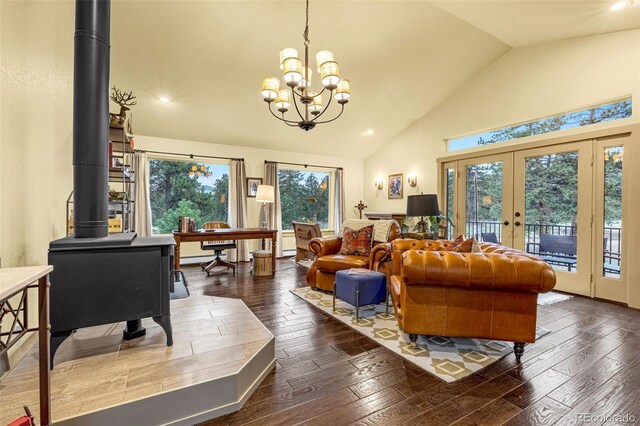 459 County Road 85, Guffey, CO 80820 - living room with french doors, a wood stove, wood-type flooring, high vaulted ceiling, and a chandelier